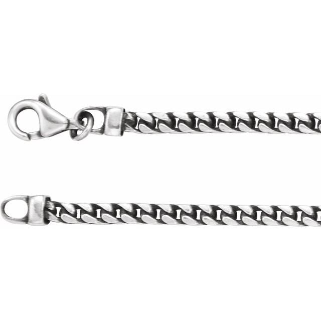 Close-up of oxidized silver Franco chain showing link detail