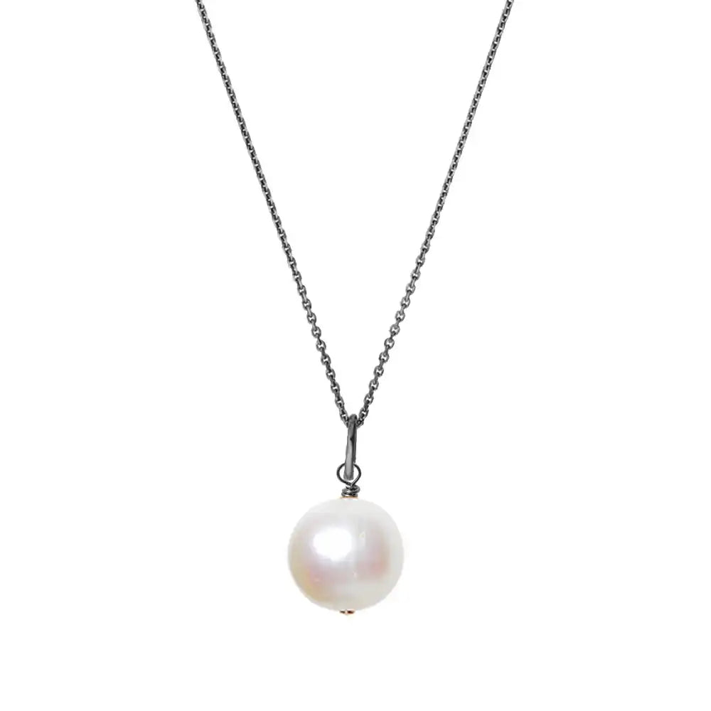 Pearl pendant necklace in oxidized silver with artisan detail