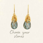 Paisley dangle earring design tool showing gemstone and metal selection options.