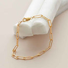 Minimalist gold bracelet with elongated oval links for layering