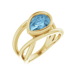 Handmade 10K gold aquamarine ring with flowing criss-cross design