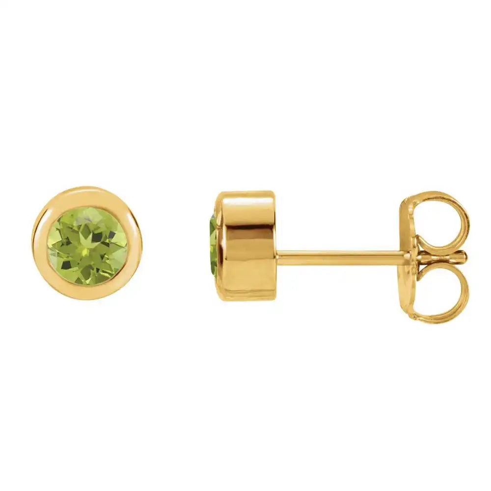 Peridot bezel stud earrings side view in 14K yellow gold