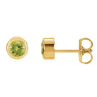 Peridot bezel stud earrings side view in 14K yellow gold