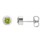 Peridot bezel stud earrings side view in 14K white gold