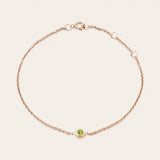 Bezel-set peridot bracelet in 14K rose gold, wrist view on model rose gold variant--14K-rose-gold