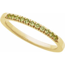 Peridot stacking band with lime-green gems in yellow gold