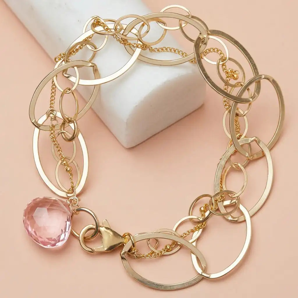 Natural pink topaz woven chain bracelet in sterling silver, styled on chain necklace