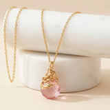 Natural pink topaz pendant necklace in gold-fill editorial shot variant--Gold-fill, variant--Rose-gold-fill, variant--Sterling-silver, variant--Oxidized-sterling-silver variant--Pink-topaz