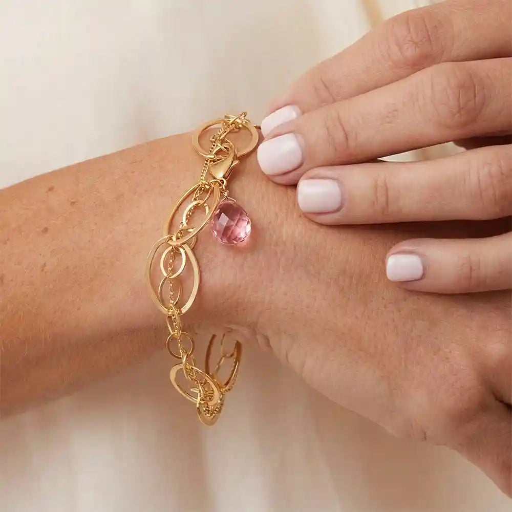 Natural pink topaz woven chain bracelet in sterling silver, close-up of setting in gold-fill variant--Gold-fill variant--Sterling-silver variant--Oxidized-sterling-silver variant--Pink-Topaz