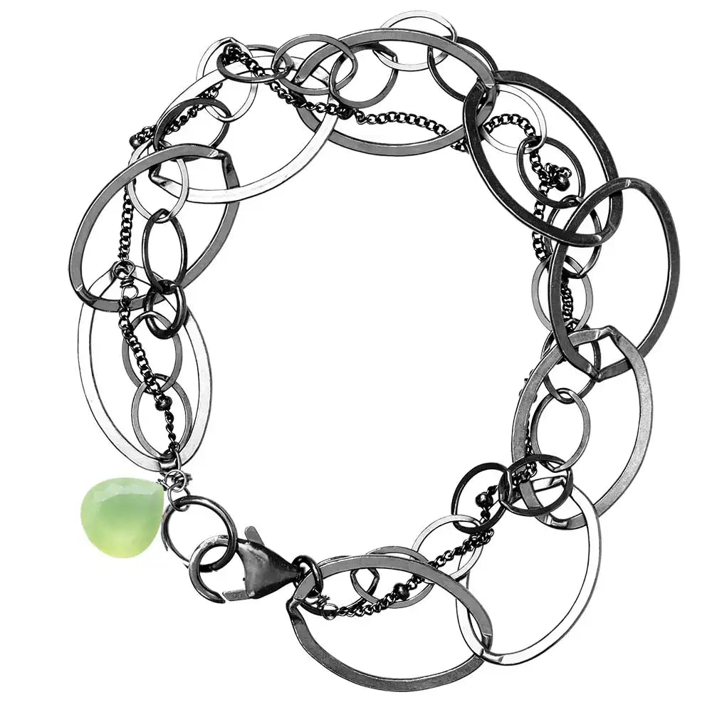 Natural prehnite woven chain bracelet in sterling silver, flat lay on neutral background sterling silver variant--Oxidized-sterling-silver