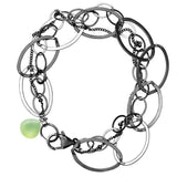 Natural prehnite woven chain bracelet in sterling silver, flat lay on neutral background sterling silver variant--Oxidized-sterling-silver