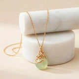 Natural prehnite pendant necklace in sterling silver, styled on chain necklace variant--Gold-fill variant--Rose-Gold-fill variant--Sterling-silver variant--Oxidized-sterling-silver variant--Prehnite
