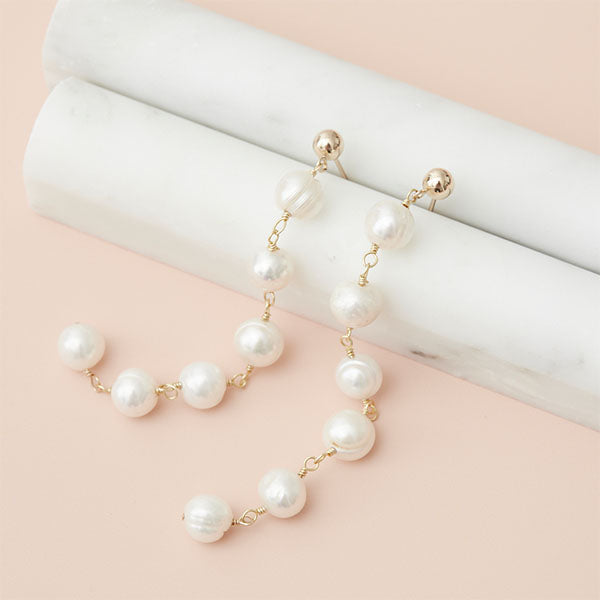 Long grey pearl chain earring in sterling silver, close-up of pearl and chain detail