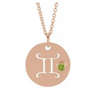 Gemini zodiac necklace in 14K rose gold with coordinating birthstone accent charm.