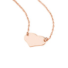 Rose gold close-up of petite polished 14K gold heart pendant showing minimalist silhouette and high-shine detail