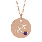 14K rose gold zodiac charm necklace for Sagittarius, paired with a natural gemstone.