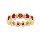 13 ruby gemstone eternity band featuring bezel settings and recycled gold