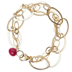 Natural ruby woven chain bracelet in 14K gold-fill, close-up of setting