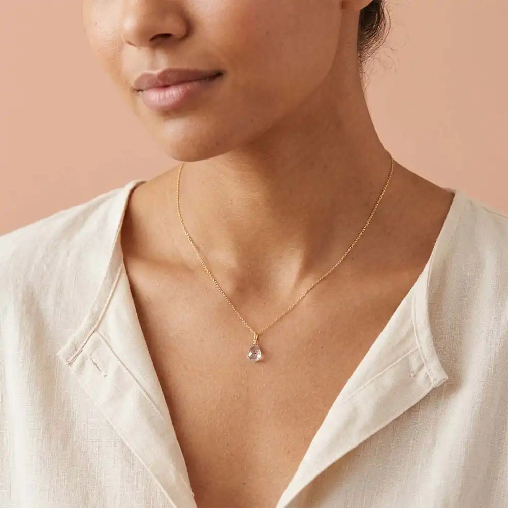 Rutilated Quartz drop necklace worn on model, lifestyle portrait