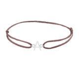 Sans serif initial A silk bracelet in 14K white gold on brown silk