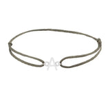 Sans serif initial A silk bracelet in 14K white gold on olive silk