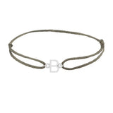 Sans serif initial B silk bracelet in sterling silver on olive silk