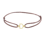 Sans serif initial D silk bracelet in 14K yellow gold on brown silk