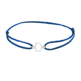Sans serif initial D silk bracelet in sterling silver on blue silk
