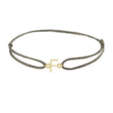 Sans serif initial F silk bracelet in 14K yellow gold on olive silk