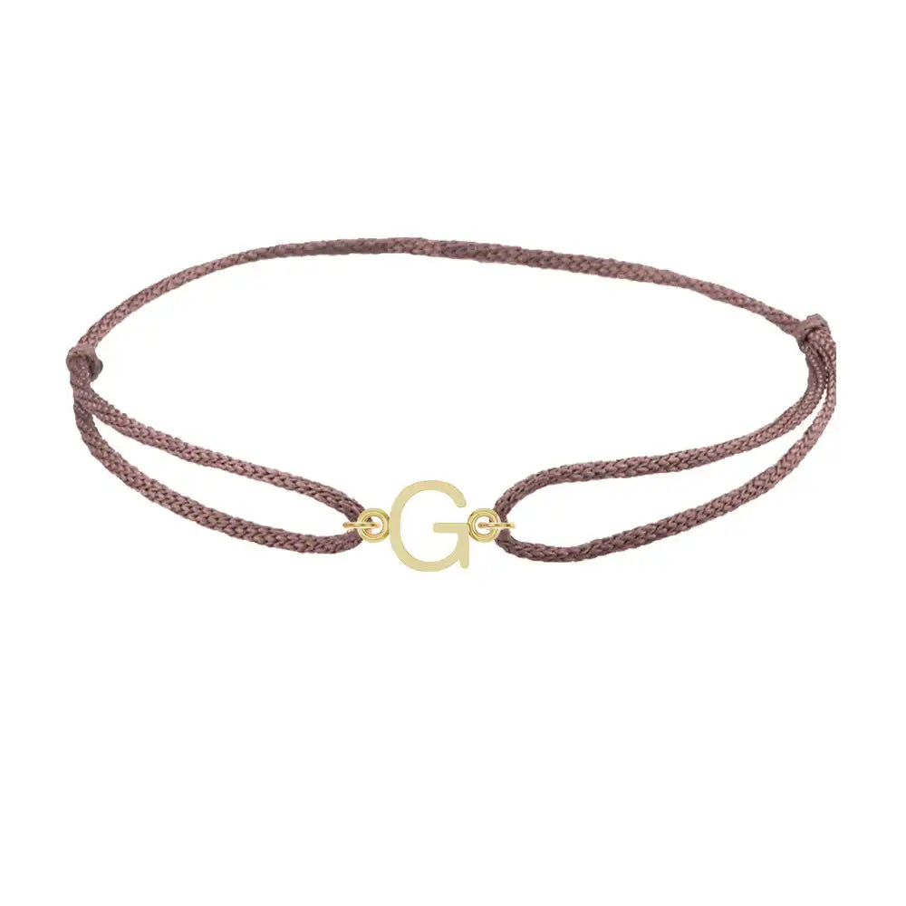 Sans serif initial G silk bracelet in 14K yellow gold on brown silk