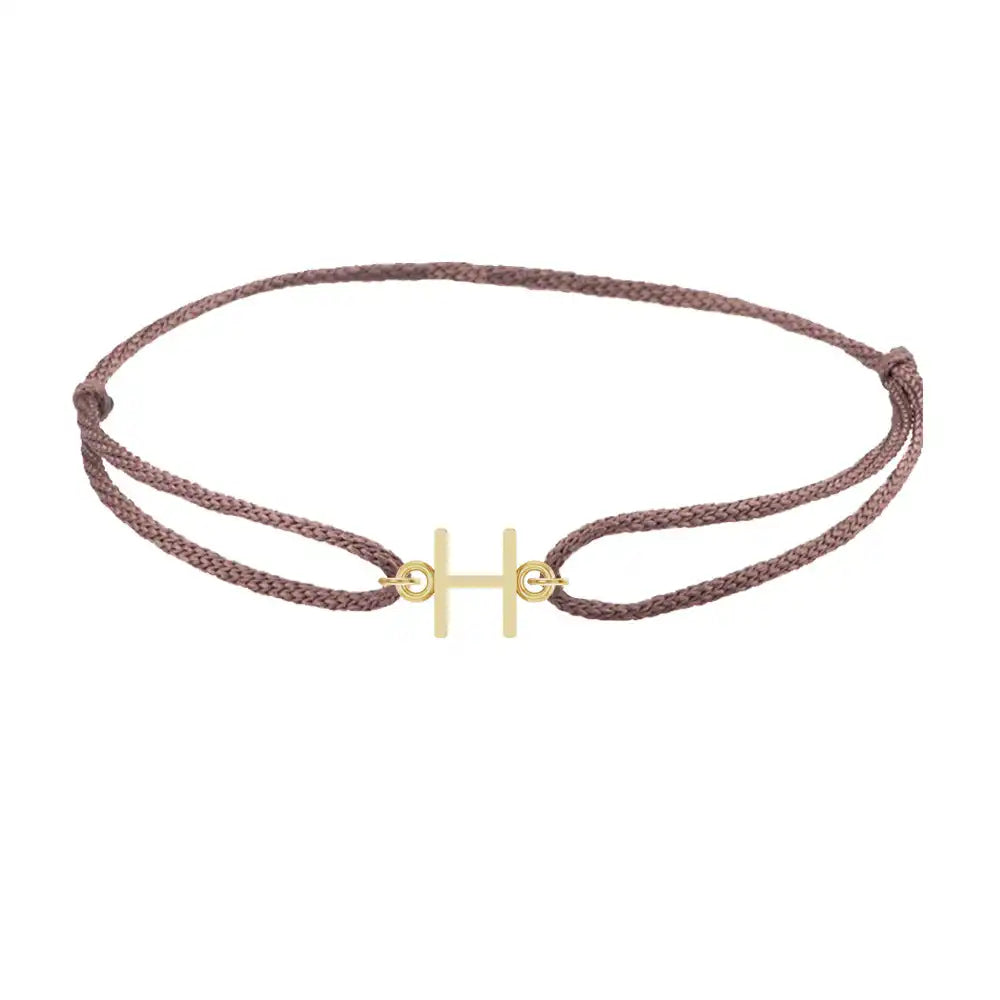 Sans serif initial H silk bracelet in 14K yellow gold on brown silk