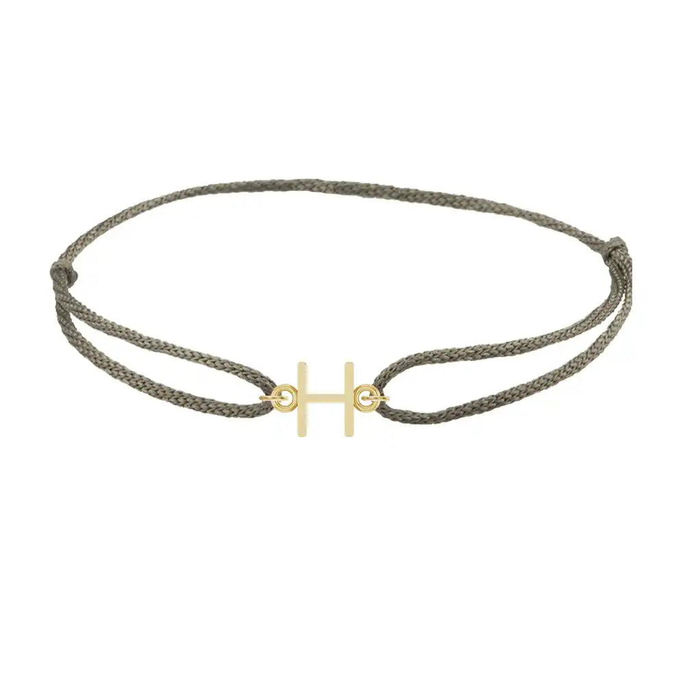 Sans serif initial H silk bracelet in 14K yellow gold on olive silk