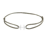 Sans serif initial H silk bracelet in sterling silver on olive silk
