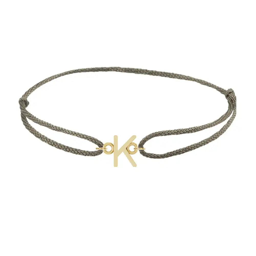 Sans serif initial K silk bracelet in 14K yellow gold on olive silk