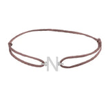 Sans serif initial N silk bracelet in 14K white gold on brown silk