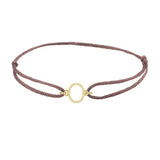 Sans serif initial O silk bracelet in 14K yellow gold on brown silk