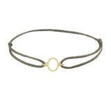 Sans serif initial O silk bracelet in 14K yellow gold on olive silk