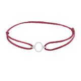 Sans serif initial O silk bracelet in sterling silver on burgundy silk
