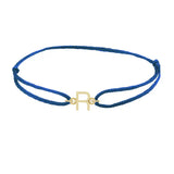 Sans serif initial R silk bracelet in 14K yellow gold on blue silk