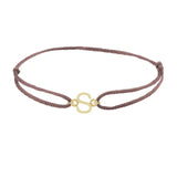 Sans serif initial S silk bracelet in 14K yellow gold on brown silk