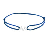 Sans serif initial V silk bracelet in 14K white gold on blue silk