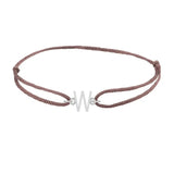 Sans serif initial W silk bracelet in 14K white gold on brown silk