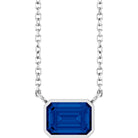 Emerald-cut sapphire solitaire necklace in white gold