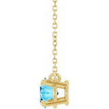 Side View East-west aquamarine necklace styled with minimalist gold jewelry