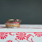 Eternity rings stacked with plain gold bands — effortless everyday styling