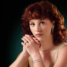 Modern heirloom flexible diamond bangle worn stacked on wrist.