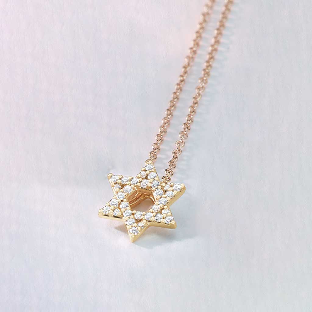 Delicate gold Star of David necklace with diamond accents