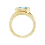 Eco-friendly cocktail ring with pear-cut blue aquamarine in sculptural setting