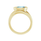 Eco-friendly cocktail ring with pear-cut blue aquamarine in sculptural setting