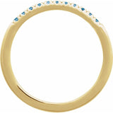 Close-up of Swiss blue topaz stacking ring in 14K yellow gold variant--14K-yellow-gold